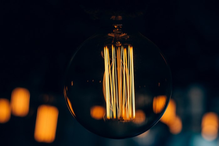 Close-up of an illuminated Edison light bulb filament
