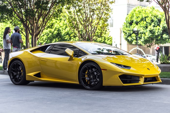 Yellow Lamborghini Huracan parked on a street