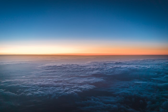 Serene Sunset Above Cloudy Horizon