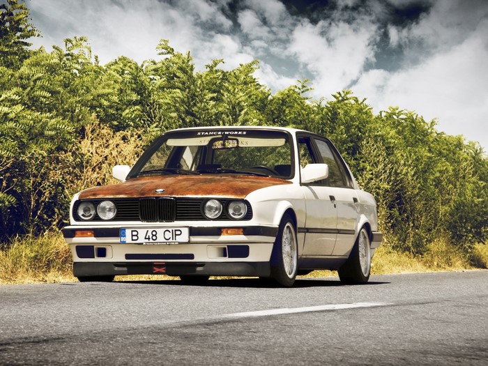White BMW E30 with Rusted Hood on Road