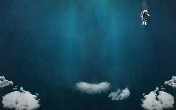 Astronaut diving in deep blue water with clouds