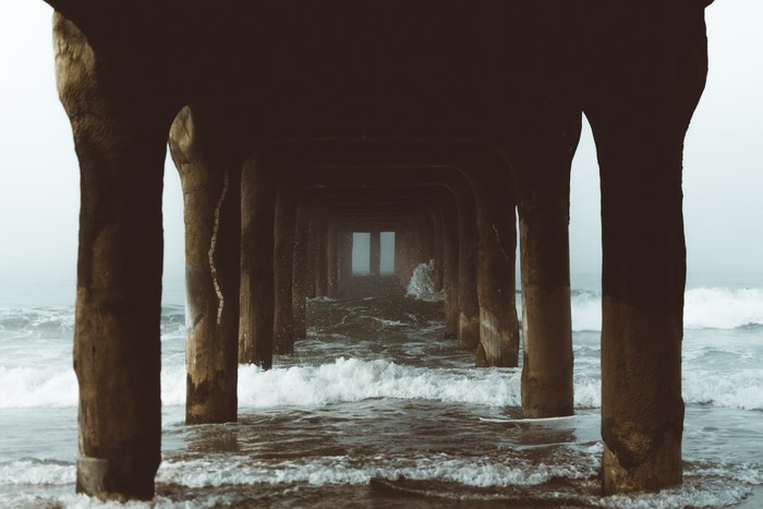 Manhattan Beach Pier tunnel with ocean waves