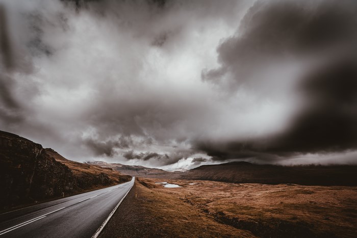 Stormy Road Through a Remote Landscape