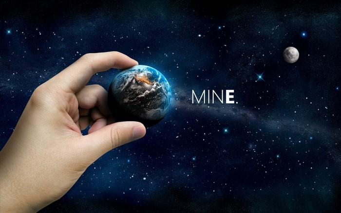 Hand holding Earth with Moon in space