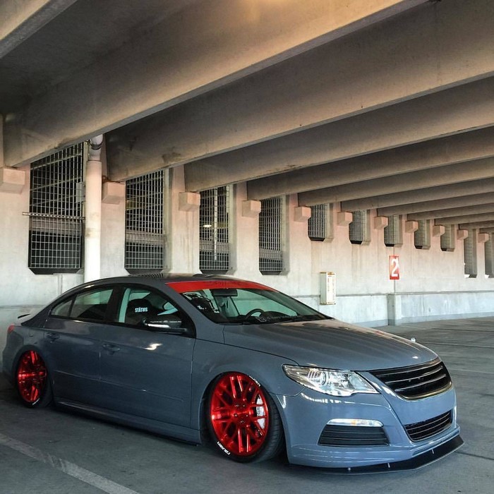 Gray Volkswagen Passat CC with red wheels