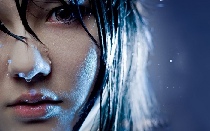 Close-up of a Japanese woman with wet hair and water drops