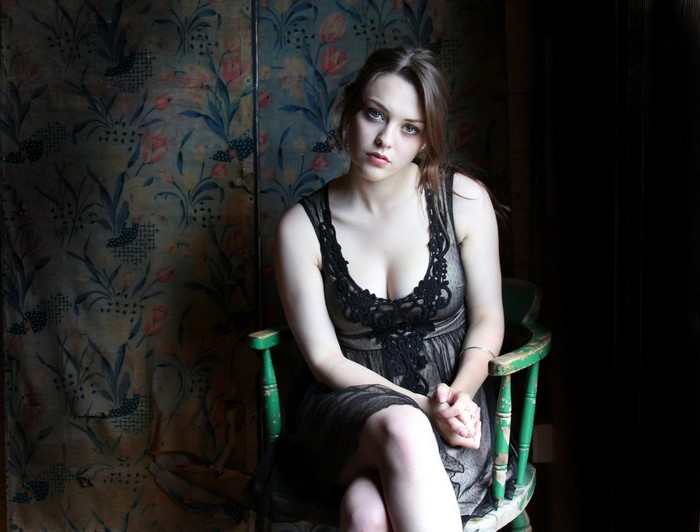 Imogen Dyer in Black Dress Sitting on Chair
