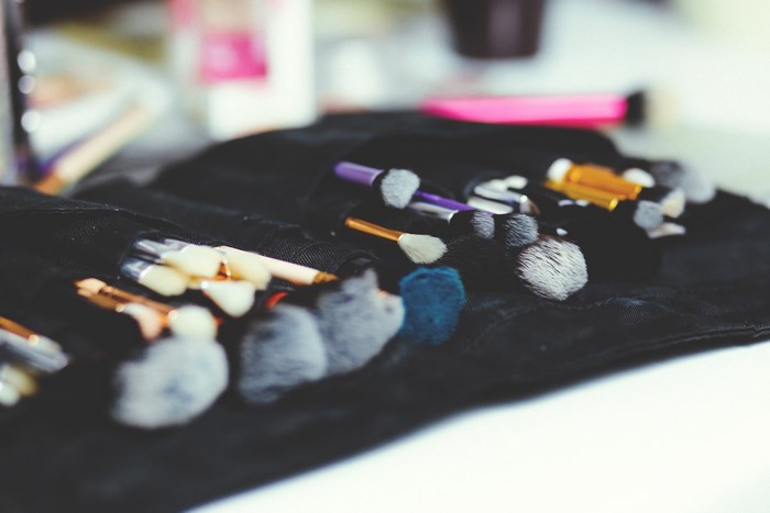 Organized makeup brush set in a black pouch