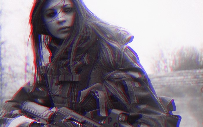 Woman in military gear holding a rifle