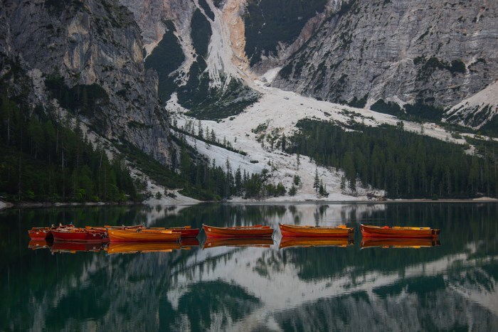 Boats on a mountain lake in the Dolomites
