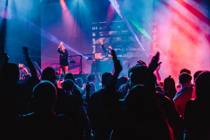 Concert crowd with performers on a stage