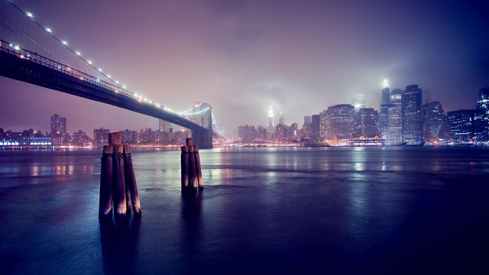 Brooklyn Bridge at night with New York City skyline