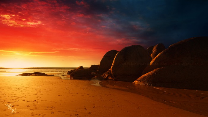 Beach sunset with rocks and ocean