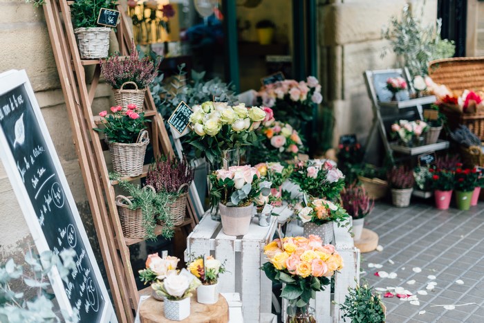 Flower shop display with baskets and chalkboard