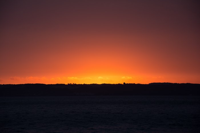 Sunset over the ocean and coastline