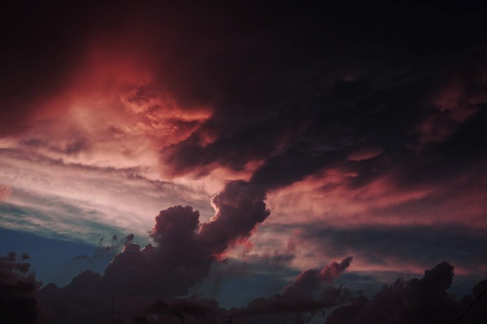 Dramatic red and dark clouds over a city