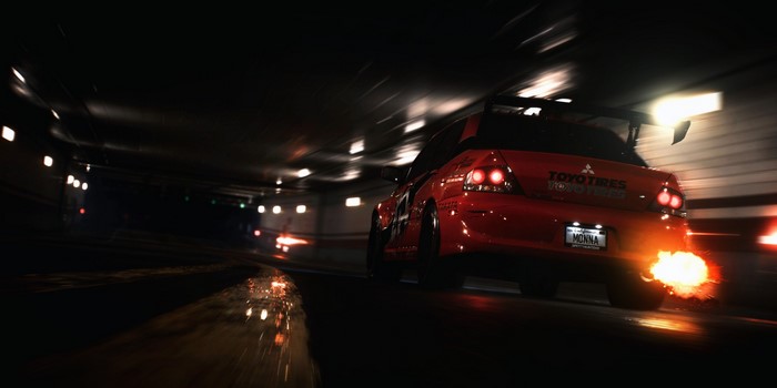 Red Mitsubishi Lancer Evolution racing in tunnel