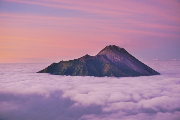 Mount Merapi above the clouds at sunrise