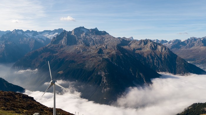 Windmill in front of foggy mountains in Engelberg