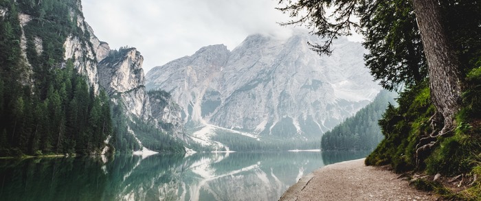 Mountain lake with forest and rocky peaks