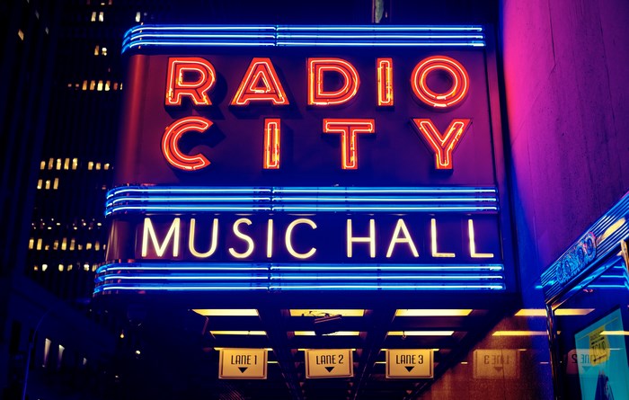Radio City Music Hall neon sign at night