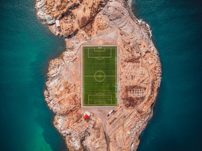 Aerial view of a football stadium on an island in Lofoten, Norway