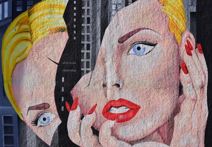 Mural of a Shattered Female Face with Blue Eyes and Red Lips