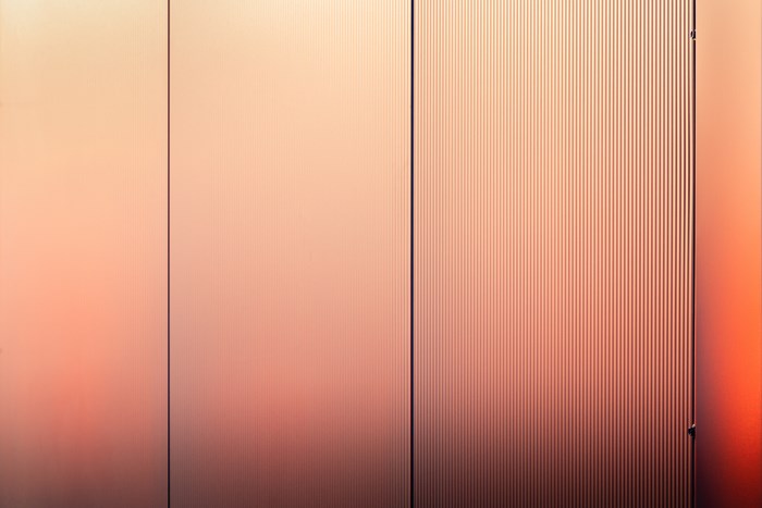 Abstract metallic surface with vertical lines and gradient