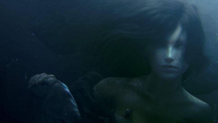 Fantasy art of a mermaid holding a fish underwater
