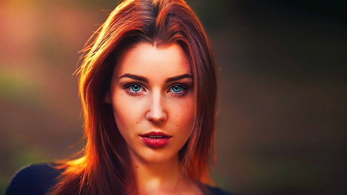 Woman with red hair and blue eyes