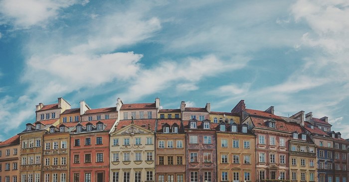 Colorful buildings under a cloudy blue sky