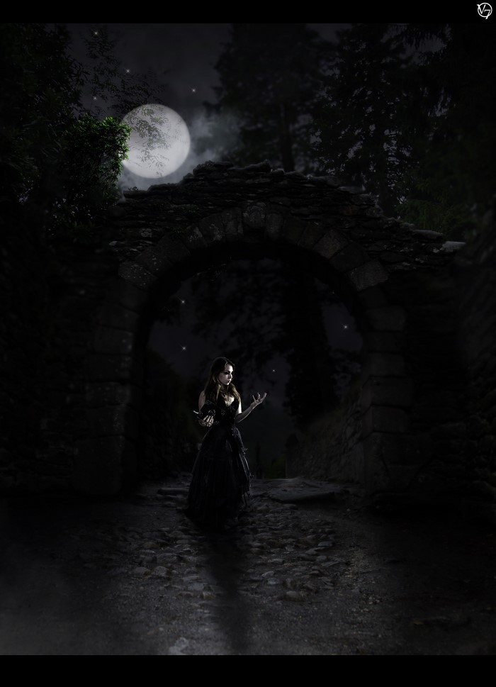 Woman in black dress under the moon near stone arch