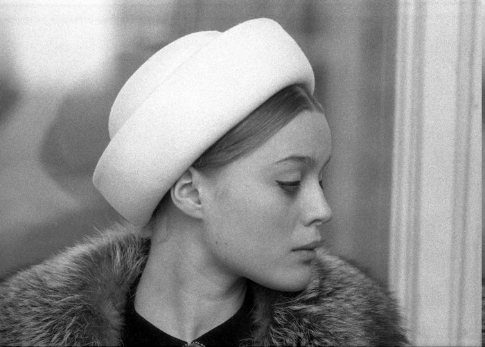 Woman in hat and fur coat, profile view
