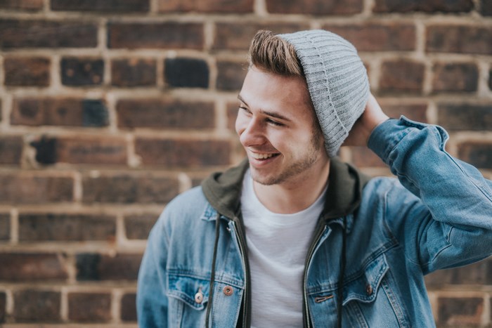 Young Man Wearing a Beanie and Denim Jacket