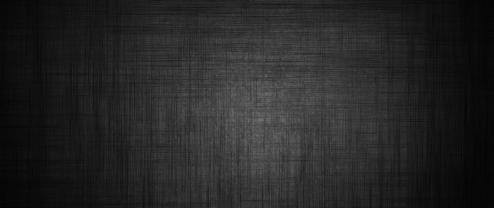 Dark textured surface with subtle lighting