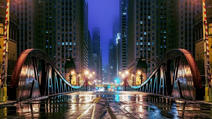 Chicago bridge at night with wet streets and fog