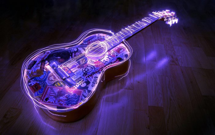 Acoustic guitar with neon lights and stickers