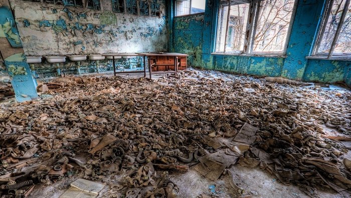Abandoned room in Chernobyl with gas masks