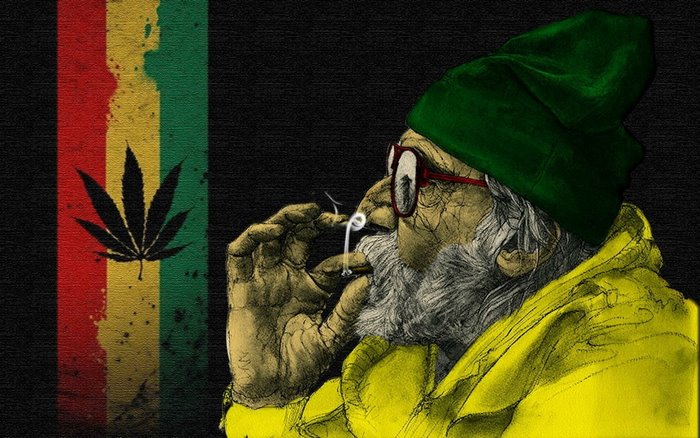 Man in green hat smoking cannabis