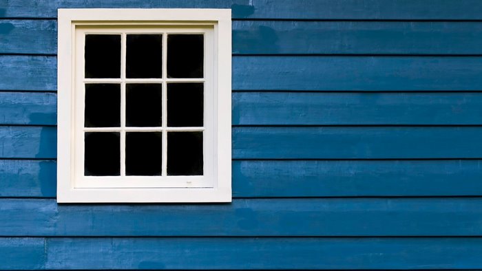 Window on blue wooden planks