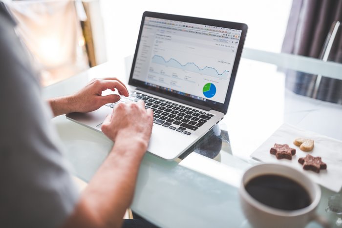 Person using laptop with Google Analytics