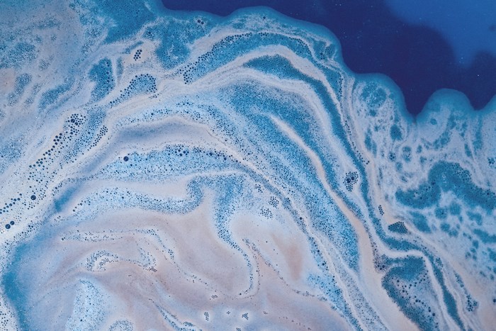 Blue and white foam with bubbles