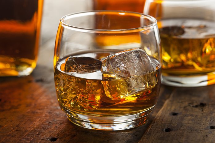 Whiskey in a glass with ice cubes
