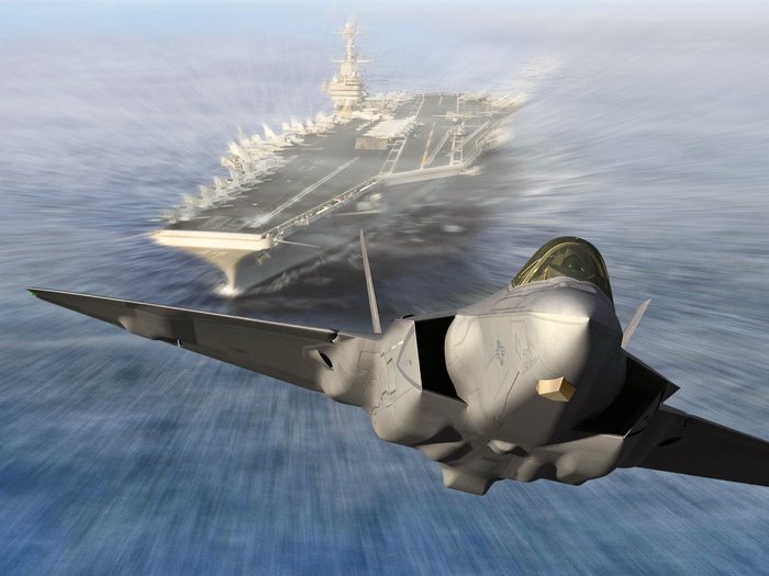 Lockheed Martin F-35 Lightning II flying near aircraft carrier