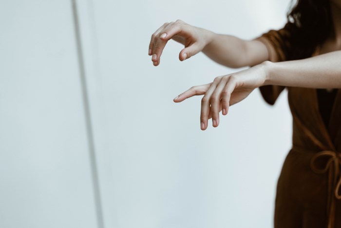 Woman's hands in a minimalist setting