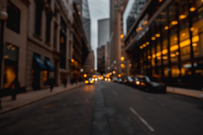 Blurry city street at night with bokeh lights
