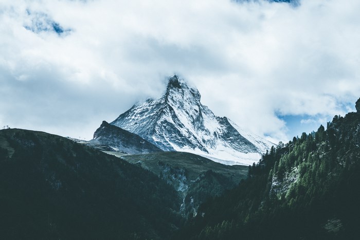 Snow-capped Matterhorn mountain peak in clouds