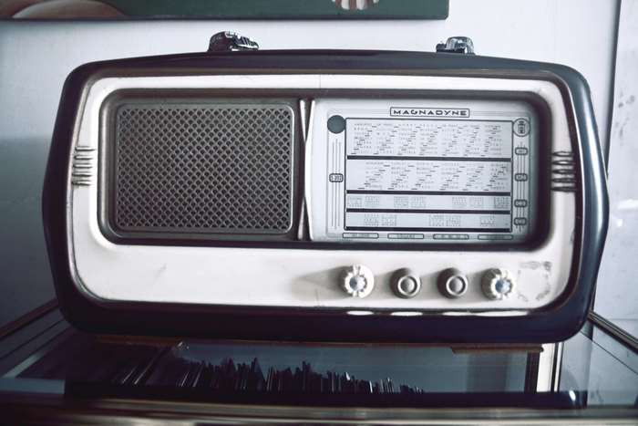 Vintage Magnadyne radio with speaker and tuning dial