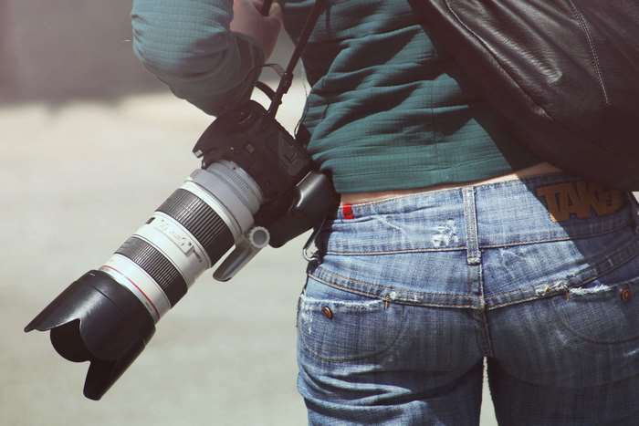 Woman with Canon Telephoto Lens Camera