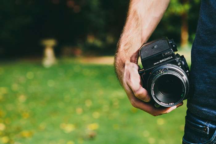 Man holding a vintage Bronica analog camera